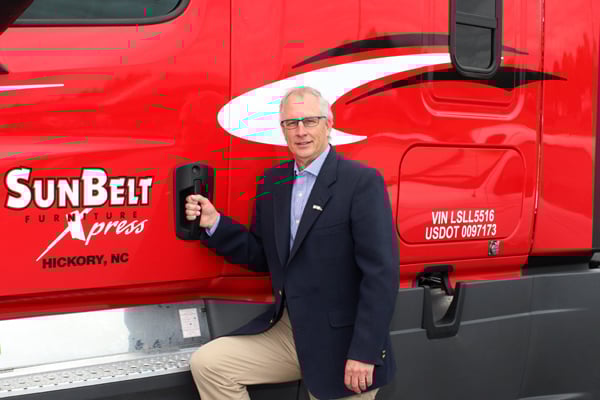 SBFX logistics expert standing in front of SBFX truck