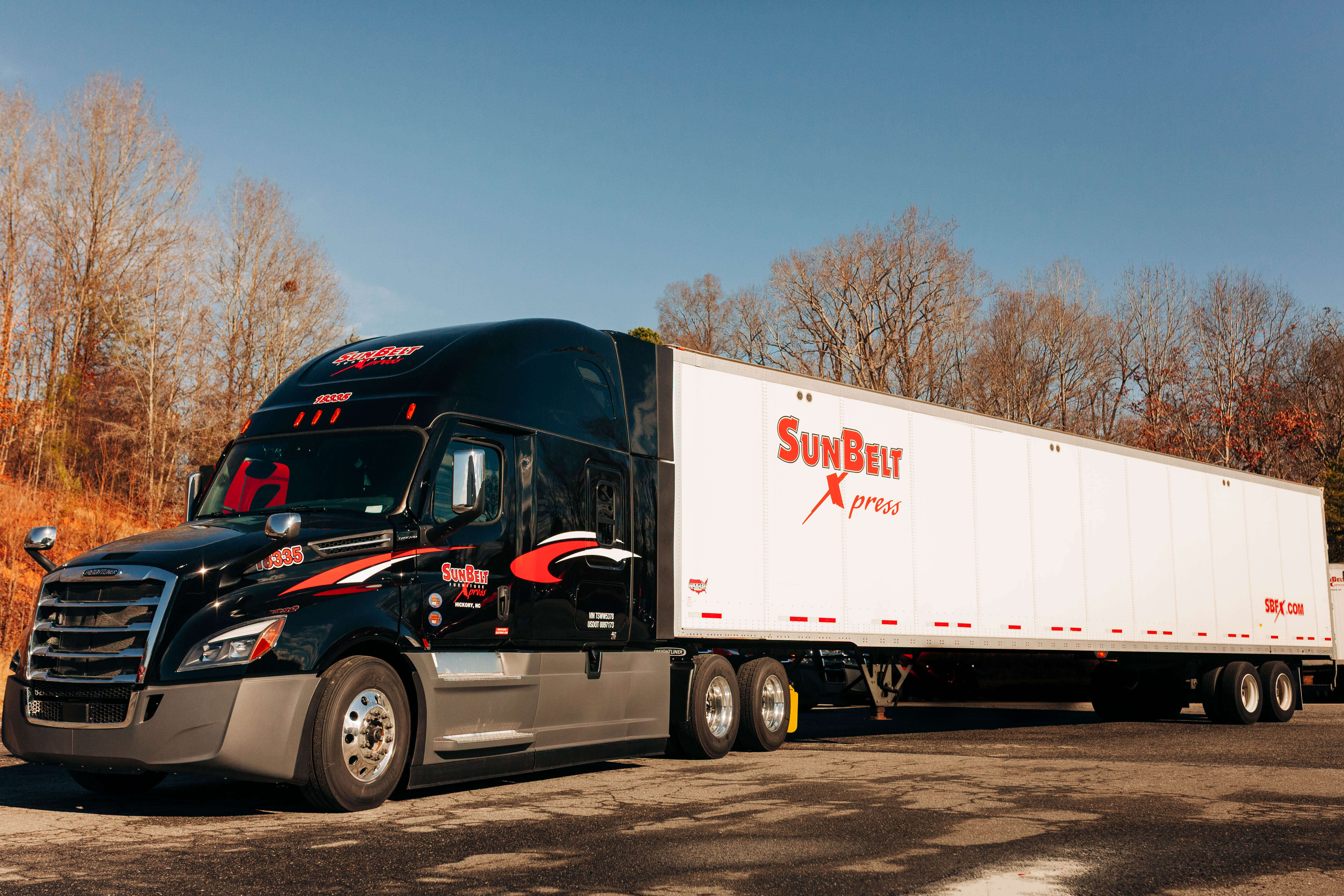 A semi truck towing a trailer, ready for truckload services on the highway.